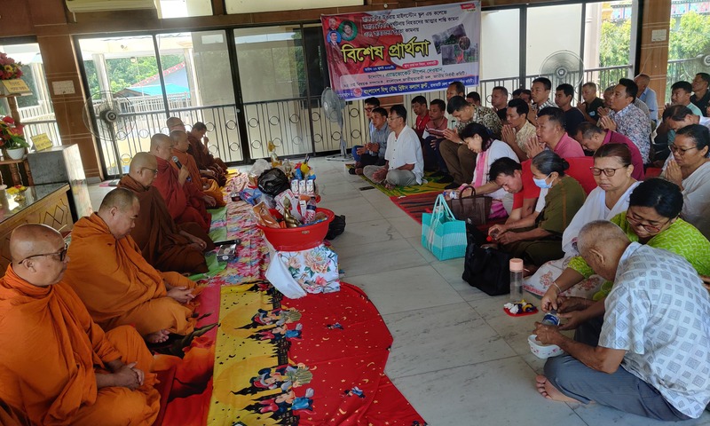 Buddhist monks, community members, and political leaders gather at Rajban Vihara in Rangamati for a solemn prayer service honoring the victims of the Milestone School plane crash. (Photo: V7N)